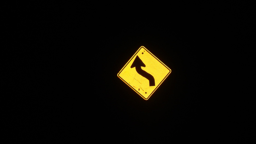 Road sign reflecting in the dark